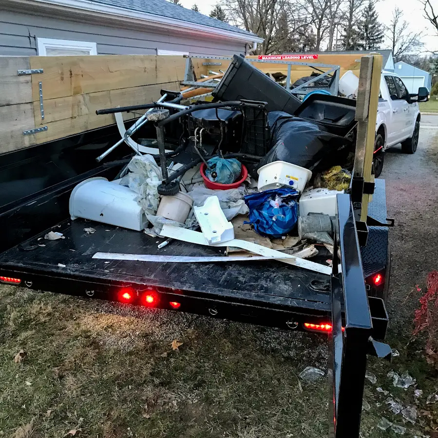 Roll-off dumpster delivered to a residential driveway in Old Bridge